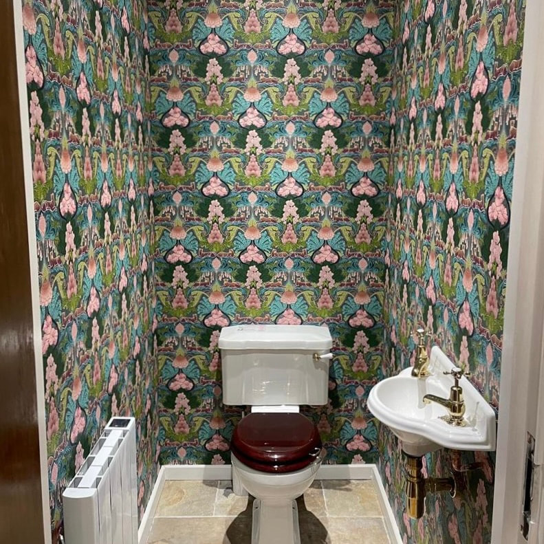 Cloakroom in patterned wallpaper